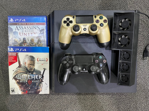 پلی استیشن ۴ فت ۱ ترابایت ps4 fat 1 tra پلمپ با دو دسته و دو دیسک بازی و کپی خور ورژن قدیم و فن خنک کننده پلم به همراه بازی و کارتن و جعبه